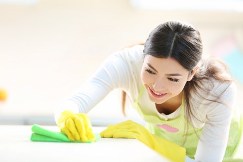 Cleaner inspecting floor conditions before carpet cleaning starts