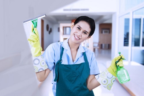 Cleaner examining a service issue after carpet cleaning